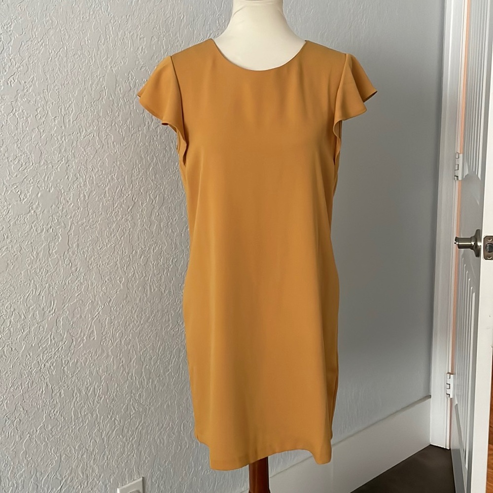 Mustard yellow dress with zipper detail at the back. Size 6
